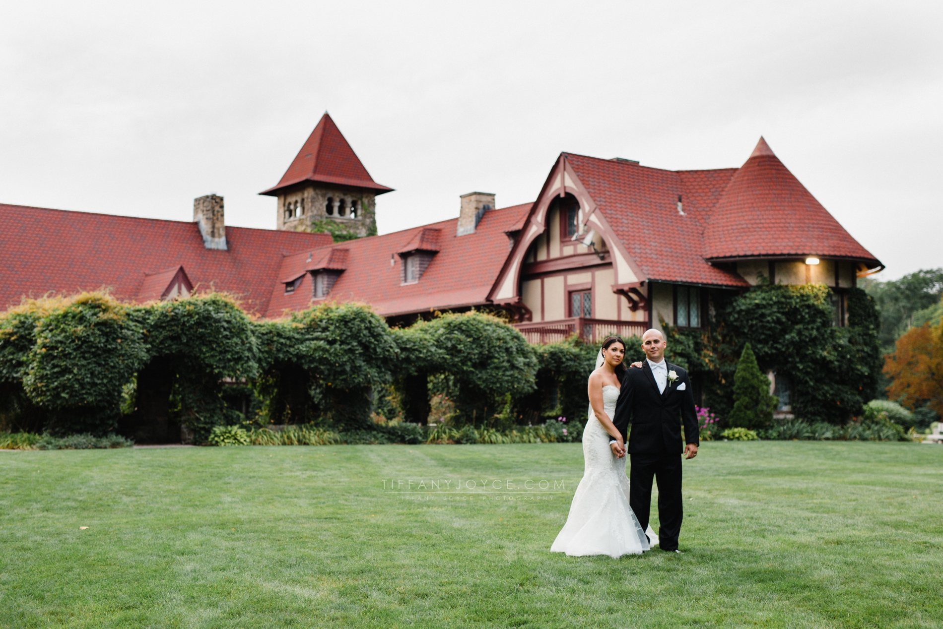 Bride and groom in front of Saint Clements Castle in Portland, CT at Saint Clements Castle wedding