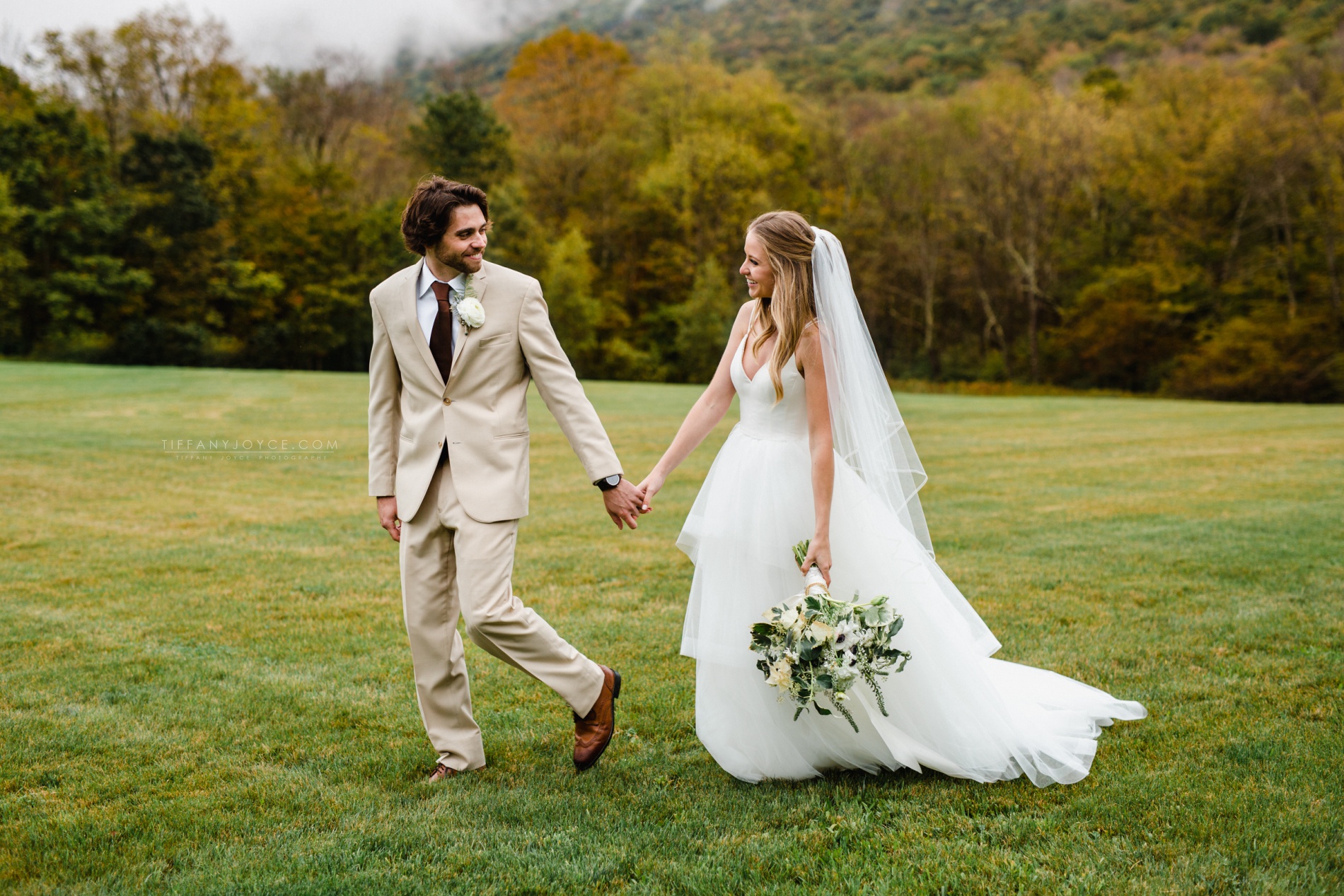 bride and groom in field at Bloom Meadows wedding