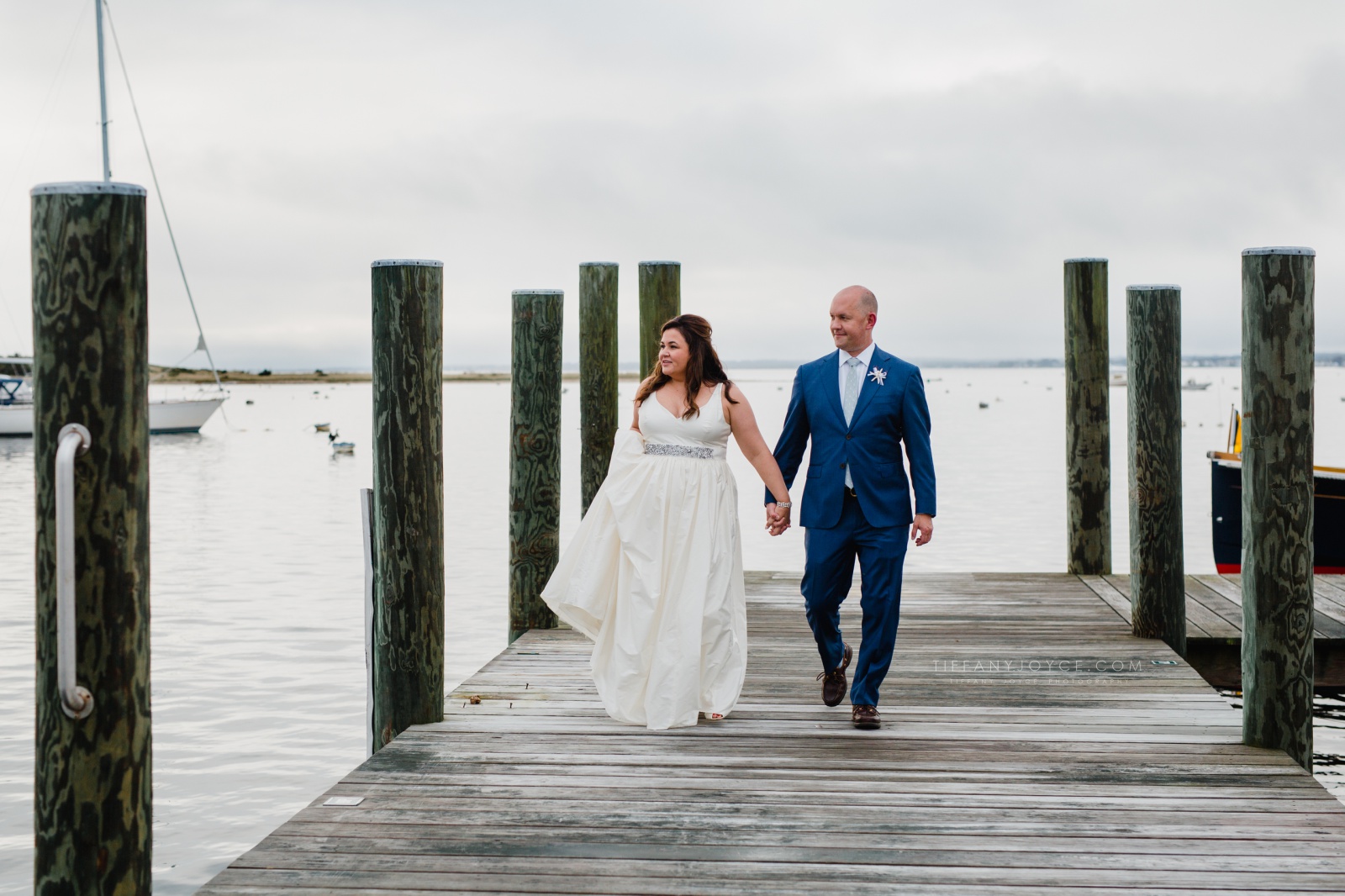 Bride and groom on docks in Rhode Island at Watch Hill wedding